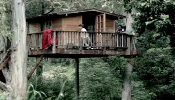 kids playing in a treehouse