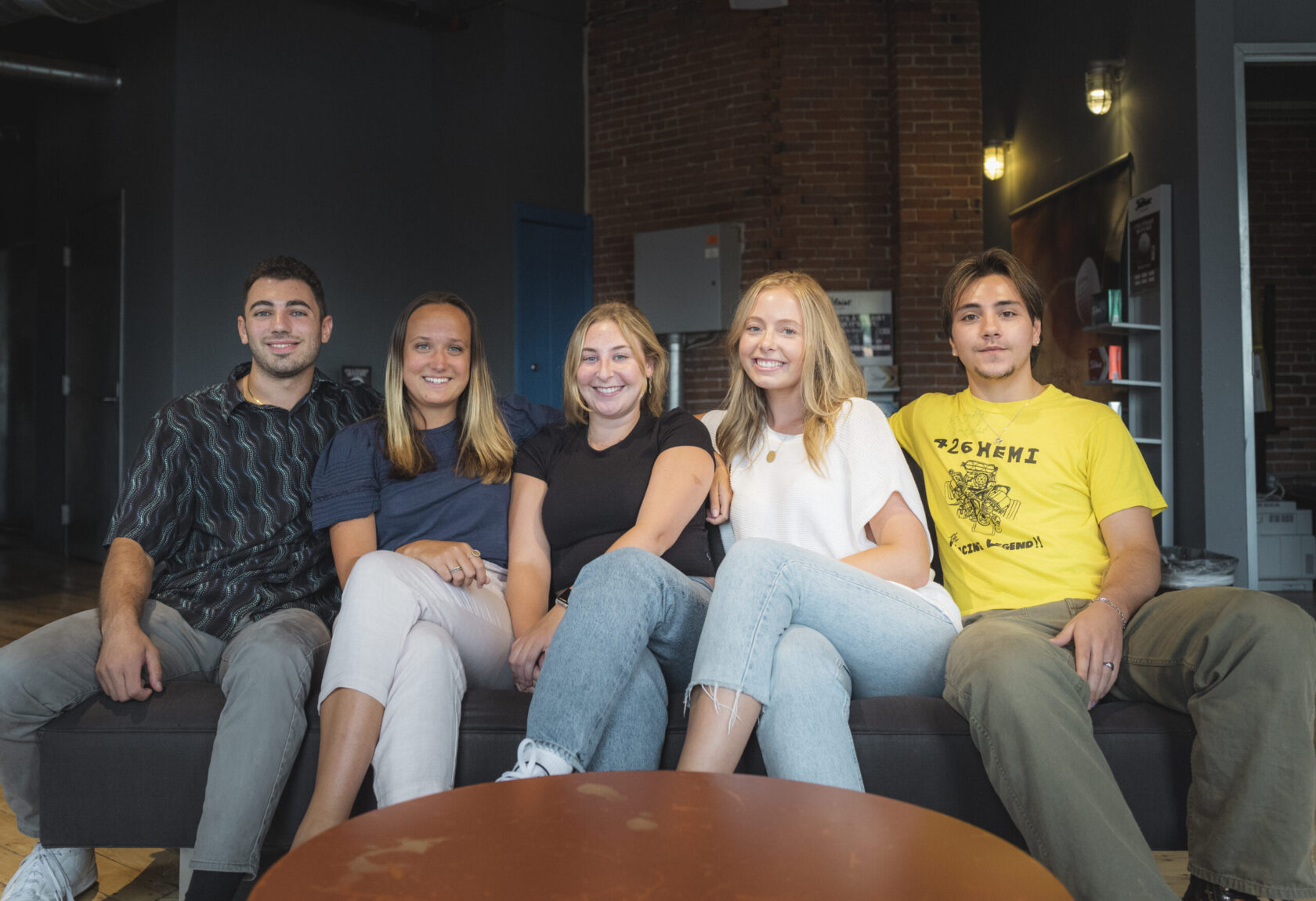 group photo of interns on sofa
