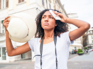 woman standing outside on a hot day