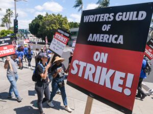 people picketing for the writers guild of america strike 