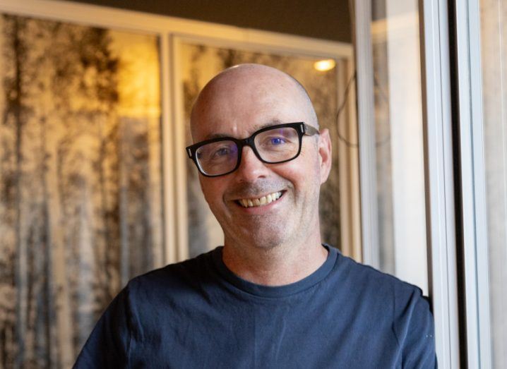 man with glasses smiling