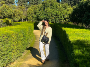 woman in a garden with a camera