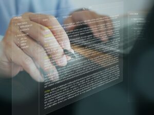 hands typing on a computer