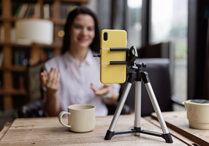 woman talking to her phone on tripod