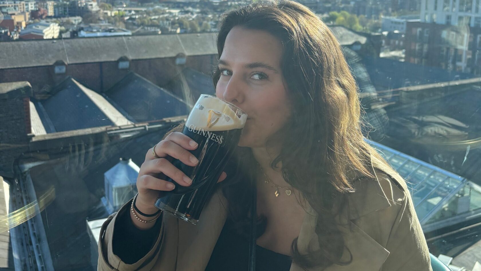 woman drinking a guinness