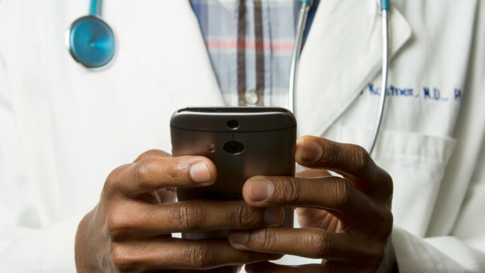 doctor holding his phone