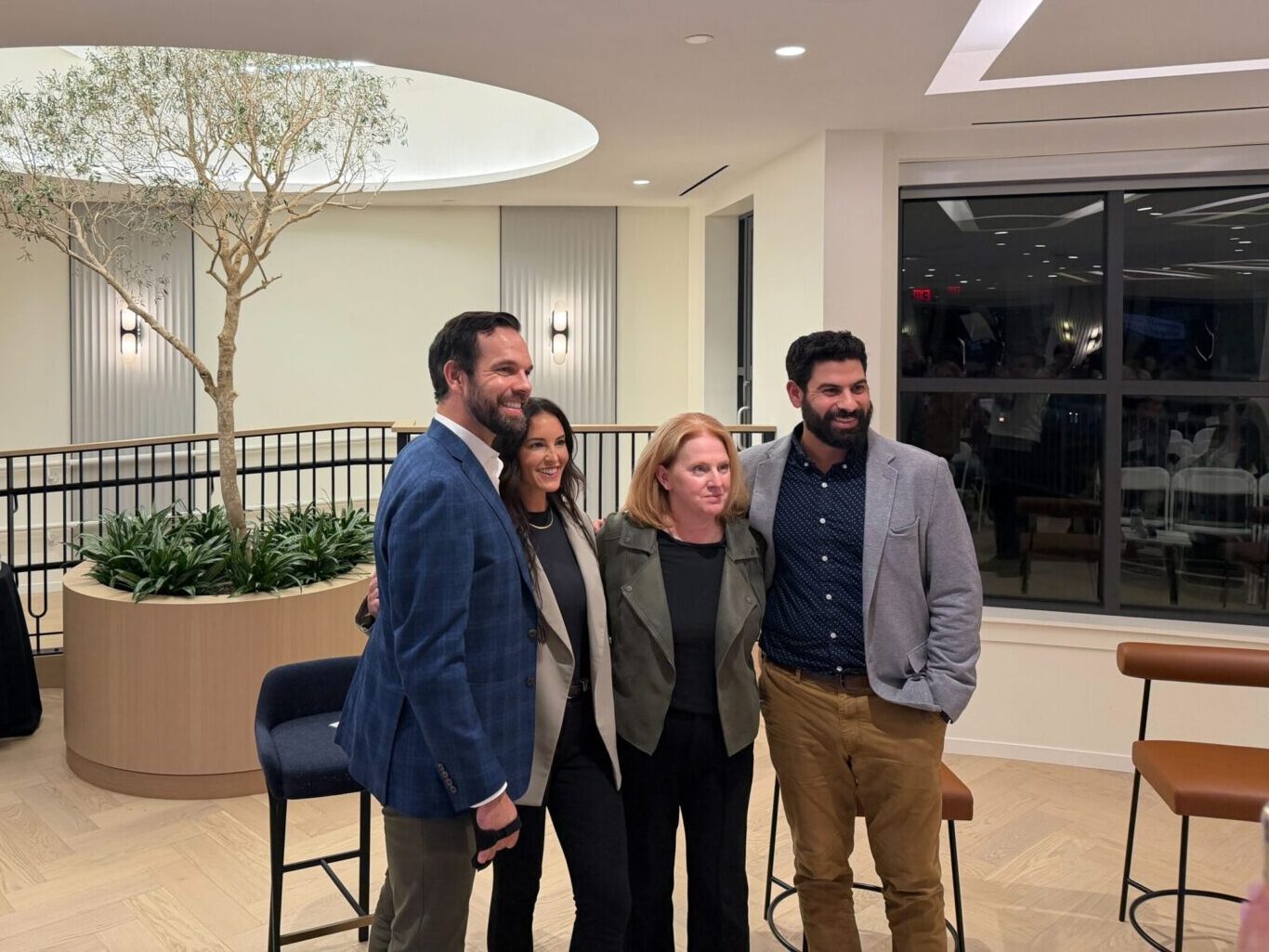 Four people posing for a picture