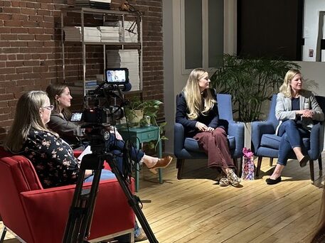 women sitting in chairs