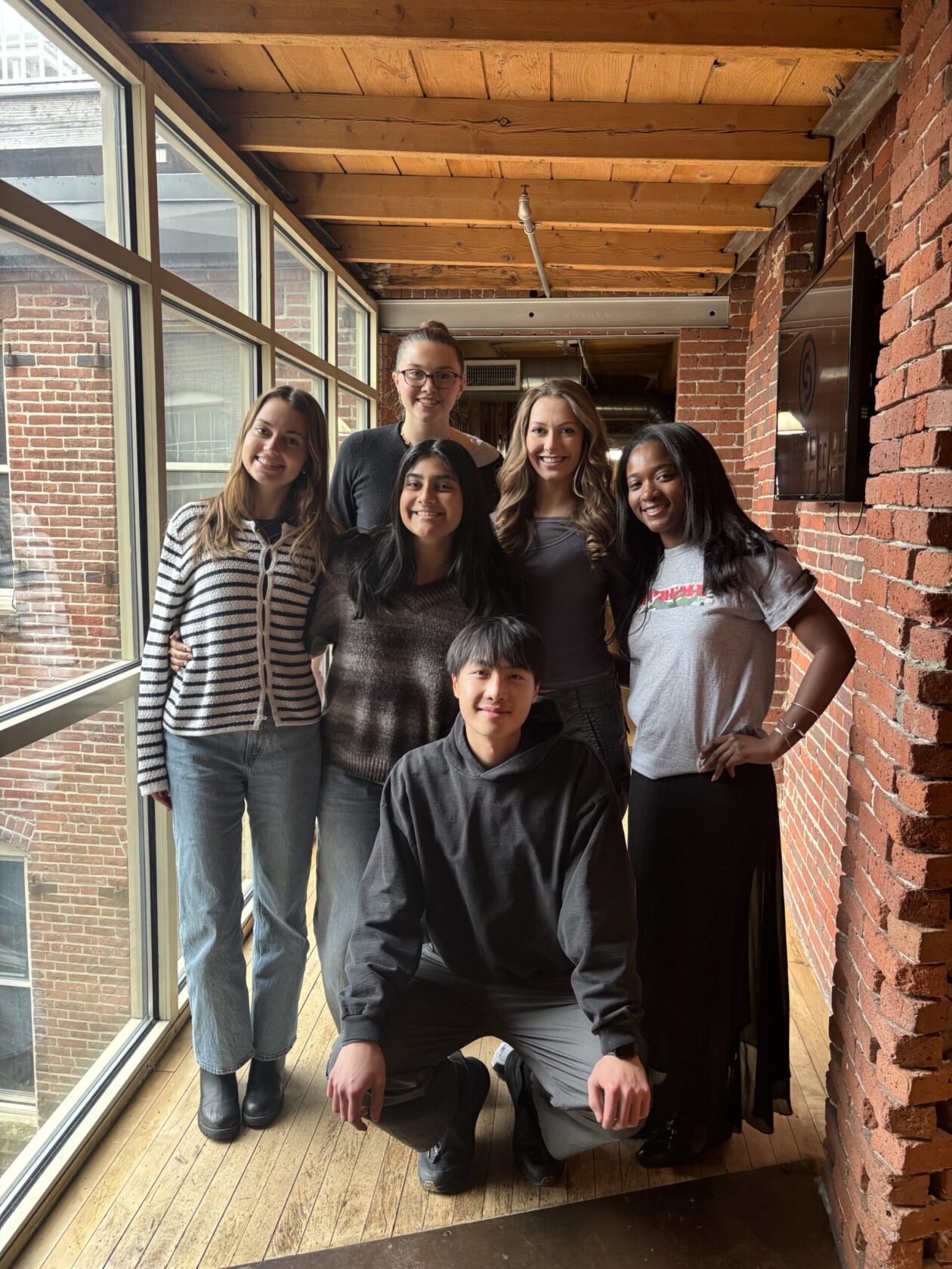 group of people standing in a hall